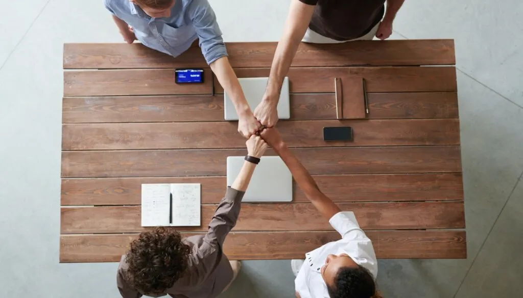 Four persons who are building a dream team
