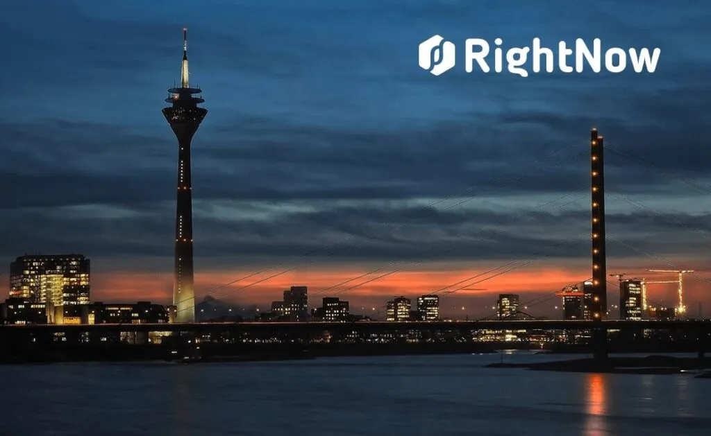 A night view of a city and logo of Rightnow group