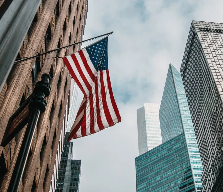 Skyscrapers and flag of USA